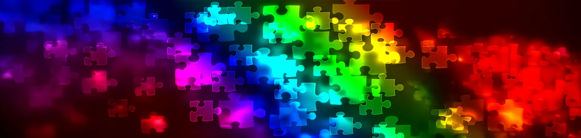 A wide panoramic rainbow coloured pictures wuth Bokeh style puzzle pieces