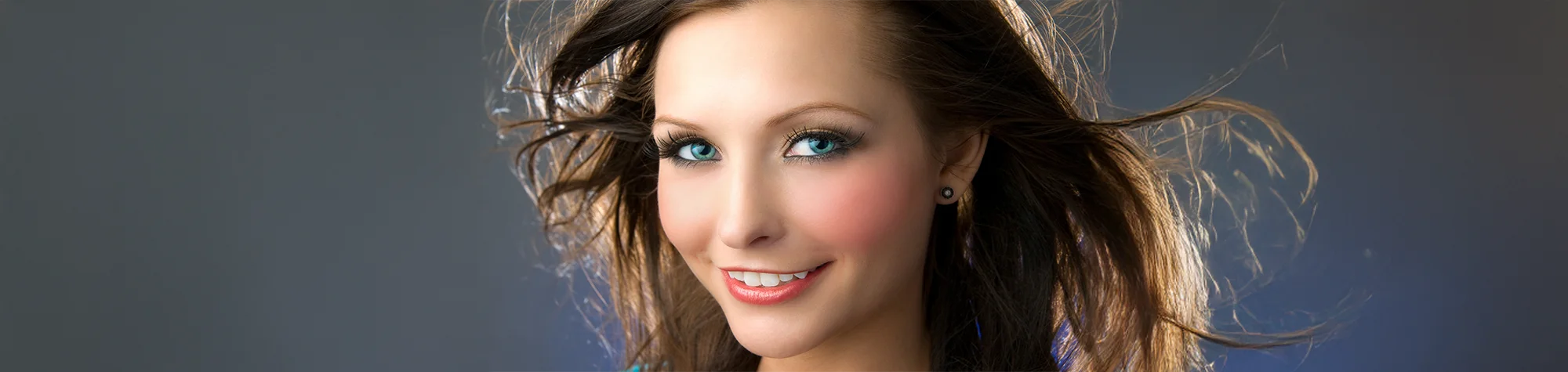 Alt Text: A wide panoramic banner showing a before and after comparison of a professional beauty retouch where pink blusher is applied to a woman's cheeks in Photoshop.