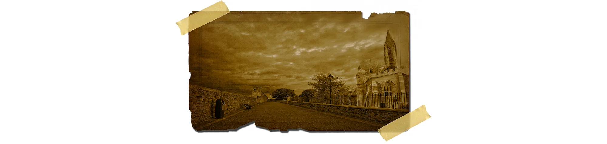 A wide panoramic banner showing a modern street scene that has a weathered, sepia-toned "Old Photo Effect" featuring dust, scratches, and a vignette.