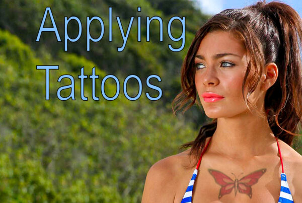 A Photoshop thumbnail showing a woman with a tattoo being adding digitally on her chest, standing in front of a beach surrounding with text "Applying Tattoos" over the top.