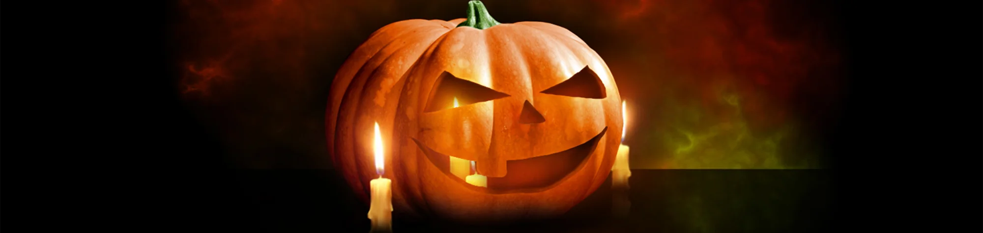 A wide panoramic banner showing a before and after comparison of a pumpkin being digitally carved and illuminated with a glowing orange light in Photoshop.